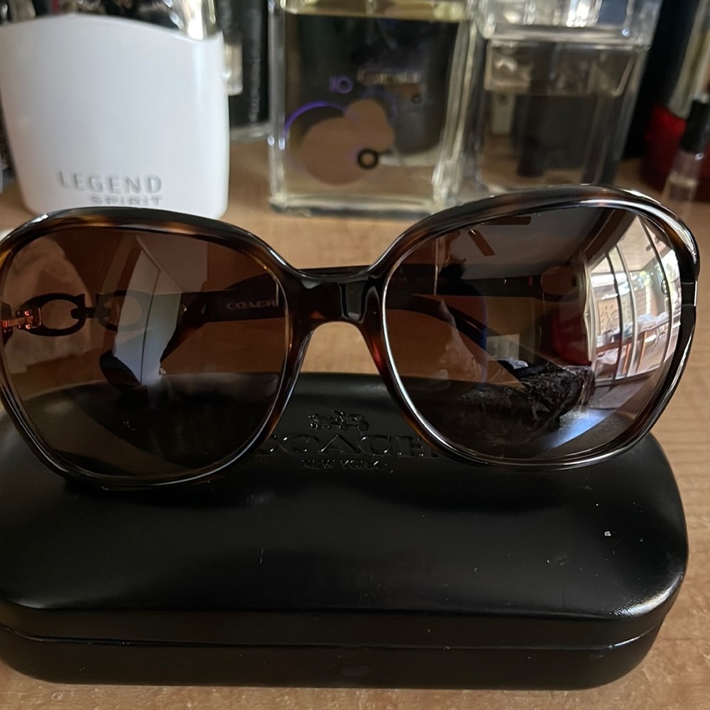 Brown glasses coach